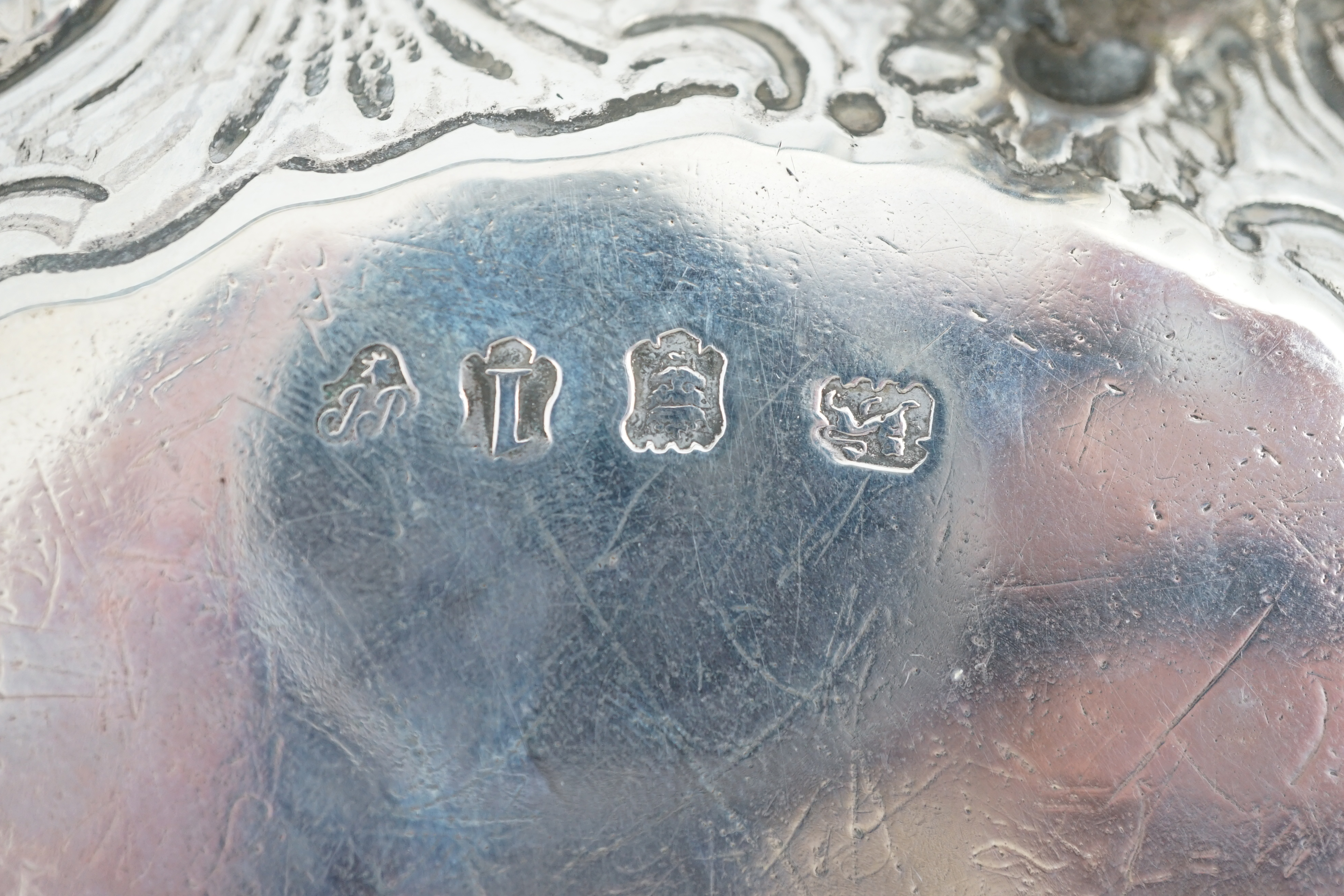 A George II silver waiter, by John Robinson II, London, 1746, with later engraved? border, on three lions paw feet